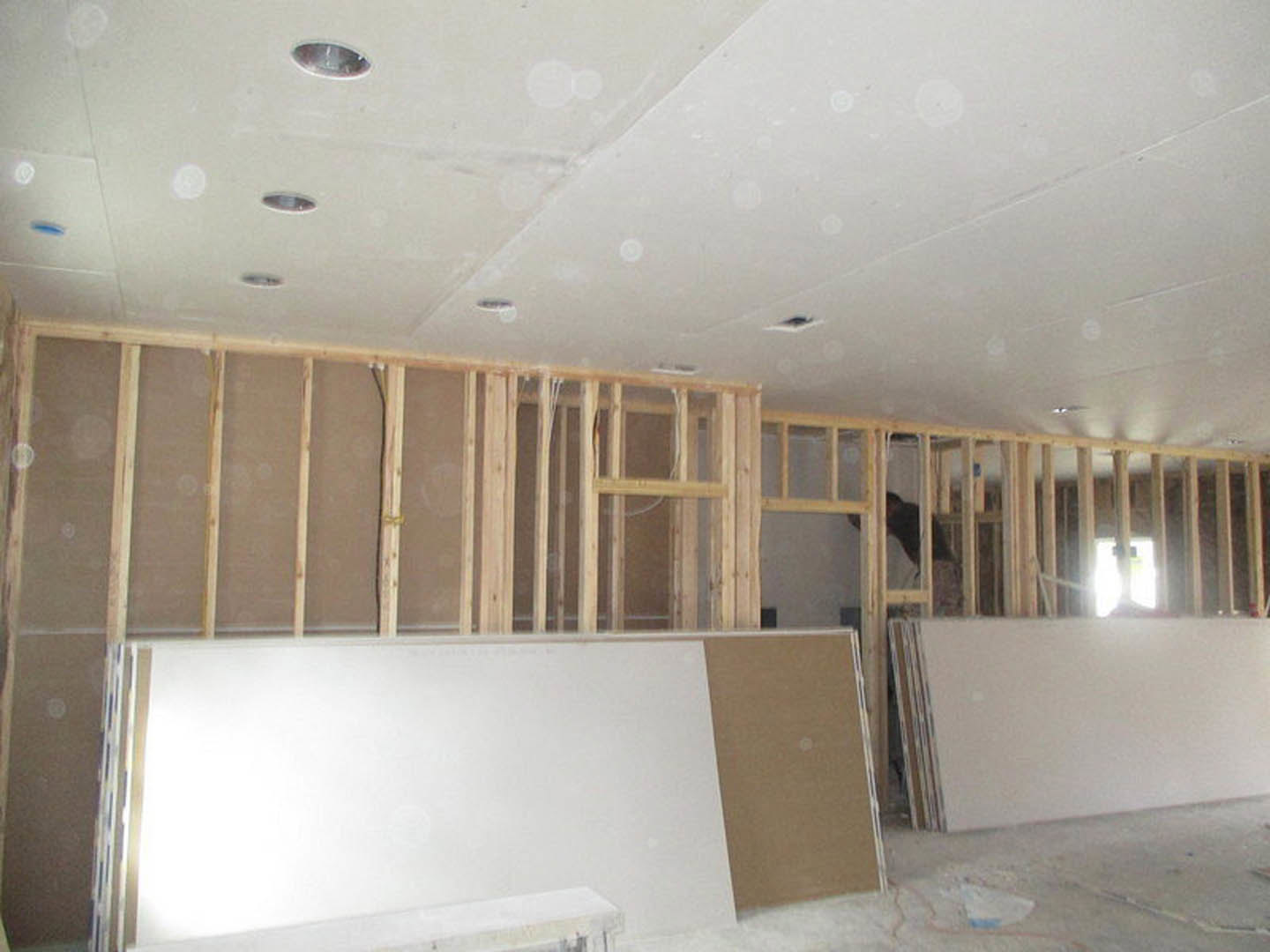 White plaster walls and ceiling with recessed circular light fixture, smooth flooring, and minimal interior detailing.